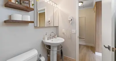 a white bathroom with a sink and a mirror at Boho Style 5 BR 2,5 BT Heated Pool Fit 14 in Miami