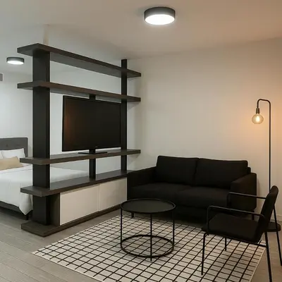 a living room with a black couch and a tv at Heart of Downtown Miami in Miami