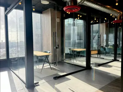a room with glass doors and tables and chairs at Heart of Downtown Miami in Miami