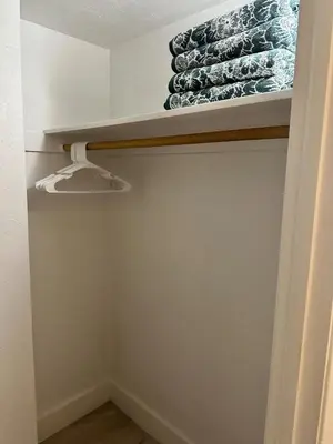 a closet with a shelf with glasses in it at Beatiful apartment 2nd Floor - SRT 3143 in Sunny Isles Beach