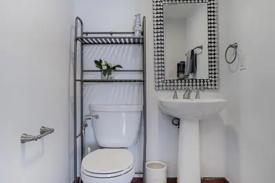 a bathroom with a toilet and a sink at Pierfront Escape in Sunny Isles Beach