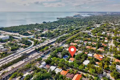 an aerial view of a city with a red marker at Brickell, Remote-Ready Oasis in Miami
