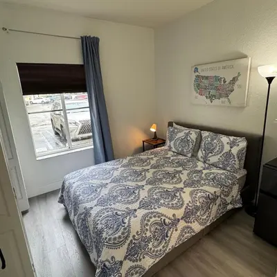a small bedroom with a bed and a window at Room w Private Entrance near Airport, Dolphin Mall & FIU in Miami