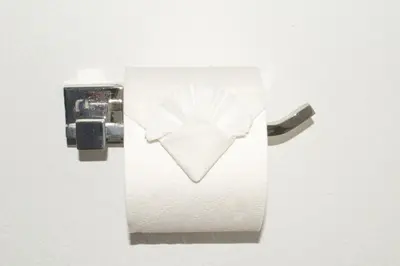 a white object with a flower on a wall at Comfortable 2BR Apartment with Pool and Gym, Steps from Jackson Memorial in Miami