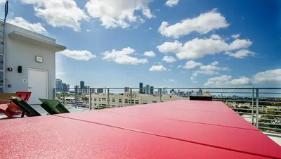 a red table on the roof of a building at LoveShack Wynwood in Miami