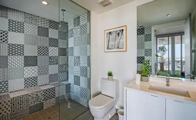 a bathroom with a toilet and a sink and a mirror at LoveShack Wynwood in Miami
