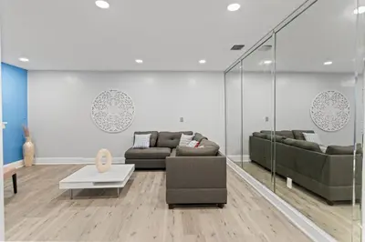 a living room with two couches and a table at Family Oasis Near Hard Rock Stadium & Beaches in Norland