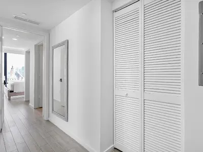 a room with white walls and a walk in closet at X Lounge VI-Premium Corner Residence in Miami