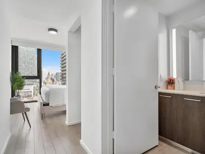 an open door to a kitchen with a view of a city at X Lounge VI-Premium Corner Residence in Miami
