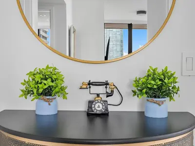 a table with two potted plants and a camera at X Lounge VI-Premium Corner Residence in Miami