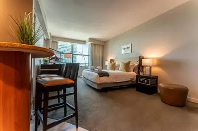 a bedroom with a bed and a large window at ★Luxury Studio with king bed+Free Parking+Netflix★ in Miami