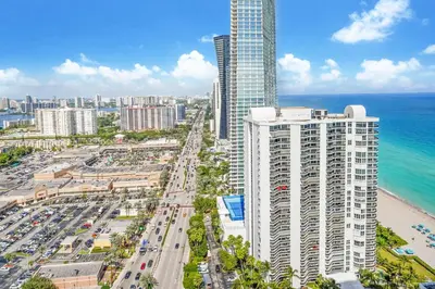 an aerial view of a city and the ocean at A Breathtaking Oceanview - High Rise Luxury Condo in Sunny Isles Beach