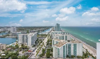 an aerial view of a city and the ocean at Luxury Living on the Beach with Resort Amenities in Hollywood