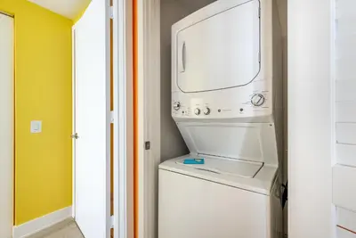 a washer and dryer in a laundry room at Luxury Living on the Beach with Resort Amenities in Hollywood