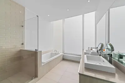 a bathroom with a tub and a sink at 2BR Ocean Penthouse - Private Terrace & Hot Tub in Hollywood