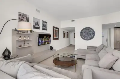 a white living room with couches and a table at Luxury Penthouse 4 BDR with Resort Amenities in Hollywood