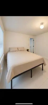 a bedroom with a large bed in a room at La sama Wynwood in Miami