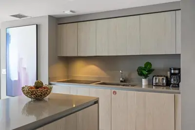 a kitchen with a bowl of fruit on a counter at 5-BR Retreat Resort & Valet Included 14 Guests in Hollywood
