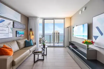 a living room with a couch and a large window at 5-BR Retreat Resort & Valet Included 14 Guests in Hollywood