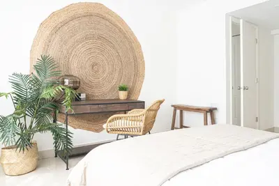 a bedroom with a bed and a table and a plant at Instant Stay Ocean Drive in Miami Beach