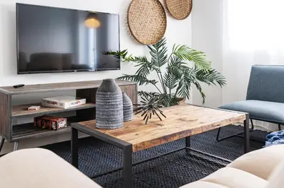 a living room with a coffee table and a tv at Instant Stay Ocean Drive in Miami Beach