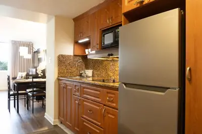 a kitchen with a refrigerator and a dining room at Beachfront Studio - Marco Polo Sunny Isles -2Beds in Sunny Isles Beach