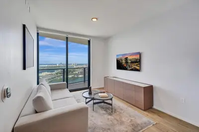 a living room with a couch and a table at Miami Lux 1BR 37th Floor Bay City Views in Miami