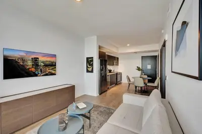 a living room with a white couch and a table at Miami Lux 1BR 37th Floor Bay City Views in Miami