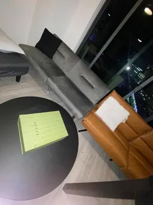 a living room with a table and a couch at Comfortable apartment in Downtown Miami in Miami