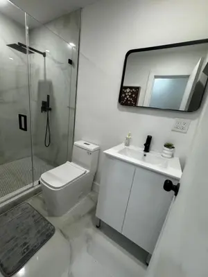 a bathroom with a toilet and a sink and a shower at Santuaria Hollywood in Hollywood