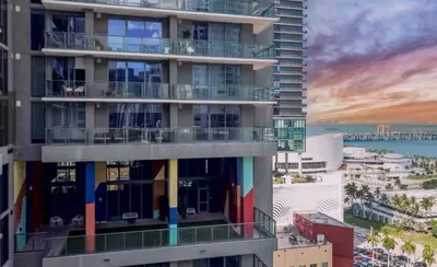 a large apartment building with rainbow balconies on it at Downtown Miami Luxury Condo apartment in Miami