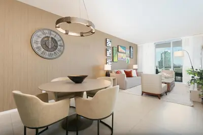 a dining room and living room with a table and chairs at Relaxing Beach Escape with Scenic Views in Hollywood