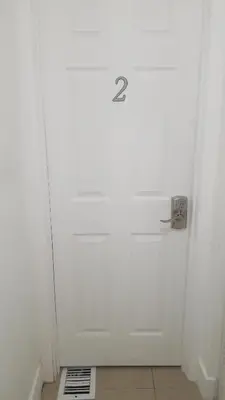 a white door with the number two on it at 1161 Efficency Miami-Lakes in Tamiami