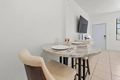 a dining room with a table and chairs at Stay in Brickell near Kaseya Center & South Beach in Miami