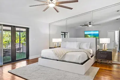 a bedroom with a bed and a ceiling fan at Cherry RoyaleGrand Villa in Davie
