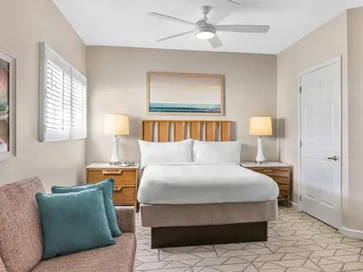 a bedroom with a bed and a couch at Marriott's Villas at Doral 2BR Apartment with Resort Access in Miami