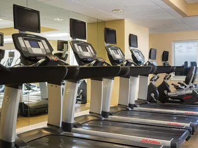 a row of tread machines in a gym at Marriott's BeachPlace Towers 1BR Apartment with Resort Access in Fort Lauderdale