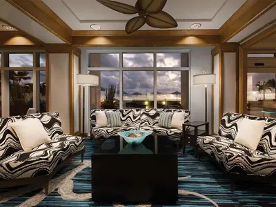 a living room with couches and a ceiling fan at Marriott's BeachPlace Towers 1BR Apartment with Resort Access in Fort Lauderdale