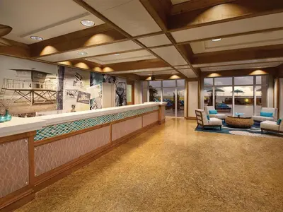 a lobby with a bar with chairs and tables at Marriott's BeachPlace Towers 2BR Apartment with Resort Access in Fort Lauderdale
