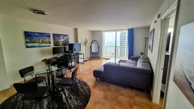 a living room with a couch and a table at 36th Floor Brickell Suite with City Skyline and Bay Views in Miami