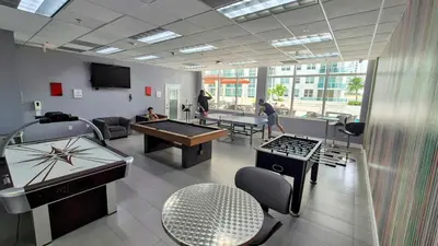 a room with ping pong tables and ping pong balls at 36th Floor Brickell Suite with City Skyline and Bay Views in Miami