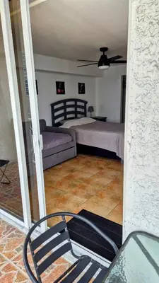 a bedroom with a bed and a couch at 36th Floor Brickell Suite with City Skyline and Bay Views in Miami