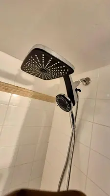a shower in a bathroom with a shower head at 36th Floor Brickell Suite with City Skyline and Bay Views in Miami