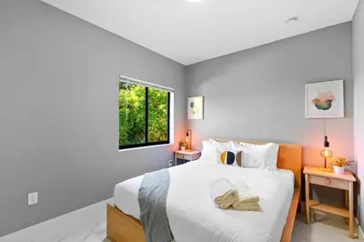 a bedroom with a large bed with a window at Family-Friendly Apt in Miami - Sleeps 4, Near Everything in Miami