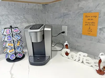 a coffeemaker sitting on a counter next to at The LuxeLanding MIA- Swimming pool, Oasis Lounge, Mini Golf, BBQ and Hibachi Grill , and Outdoor Games in Miami