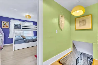 a bedroom with green walls and a bunk bed at Casa Alaïa West Brickell Sleeps 20 Pool&Spa in Miami