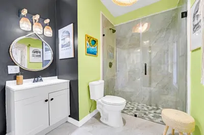 a bathroom with a shower and a toilet and a sink at Casa Alaïa West Brickell Sleeps 20 Pool&Spa in Miami