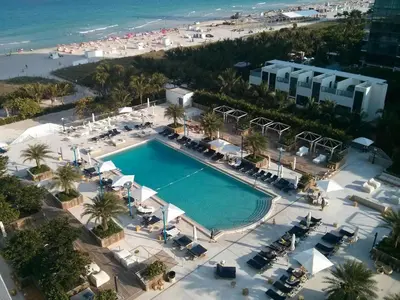 an overhead view of a swimming pool next to a beach at 2 bedroom at The Roney Palace Condominiums Apt 1006 in Miami Beach