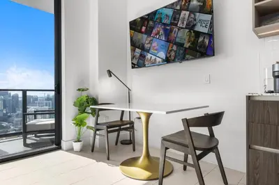 a dining room with a table and chairs and a window at Gale Hotel - Premium Studio W Panoramic City Views in Miami