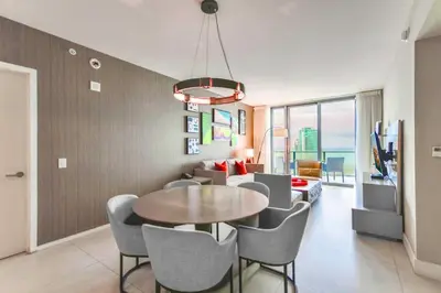 a dining room with a table and chairs at Charming Condo for Your Dream Vacation in Hollywood